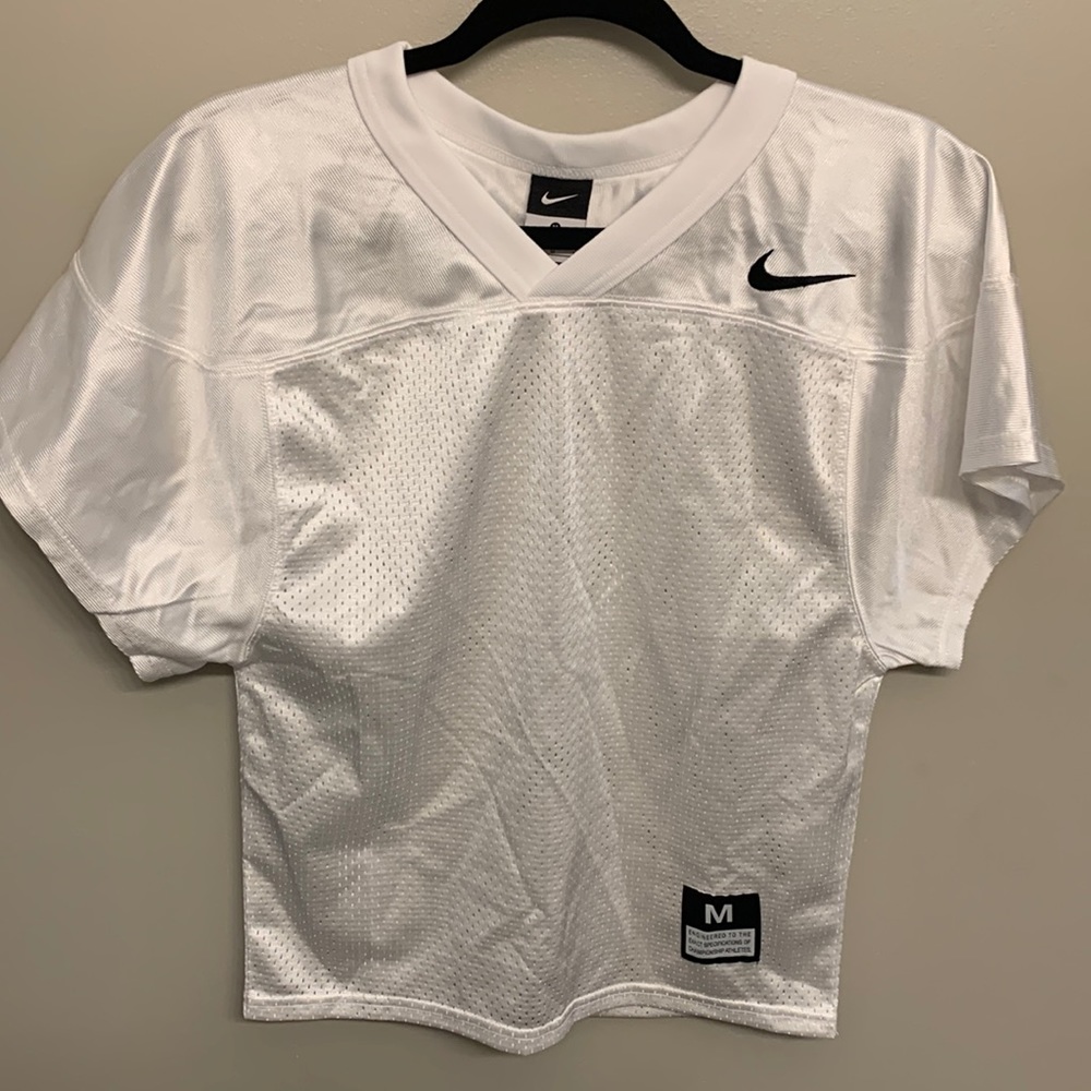 Nike boys medium plain white football jersey. Never worn.